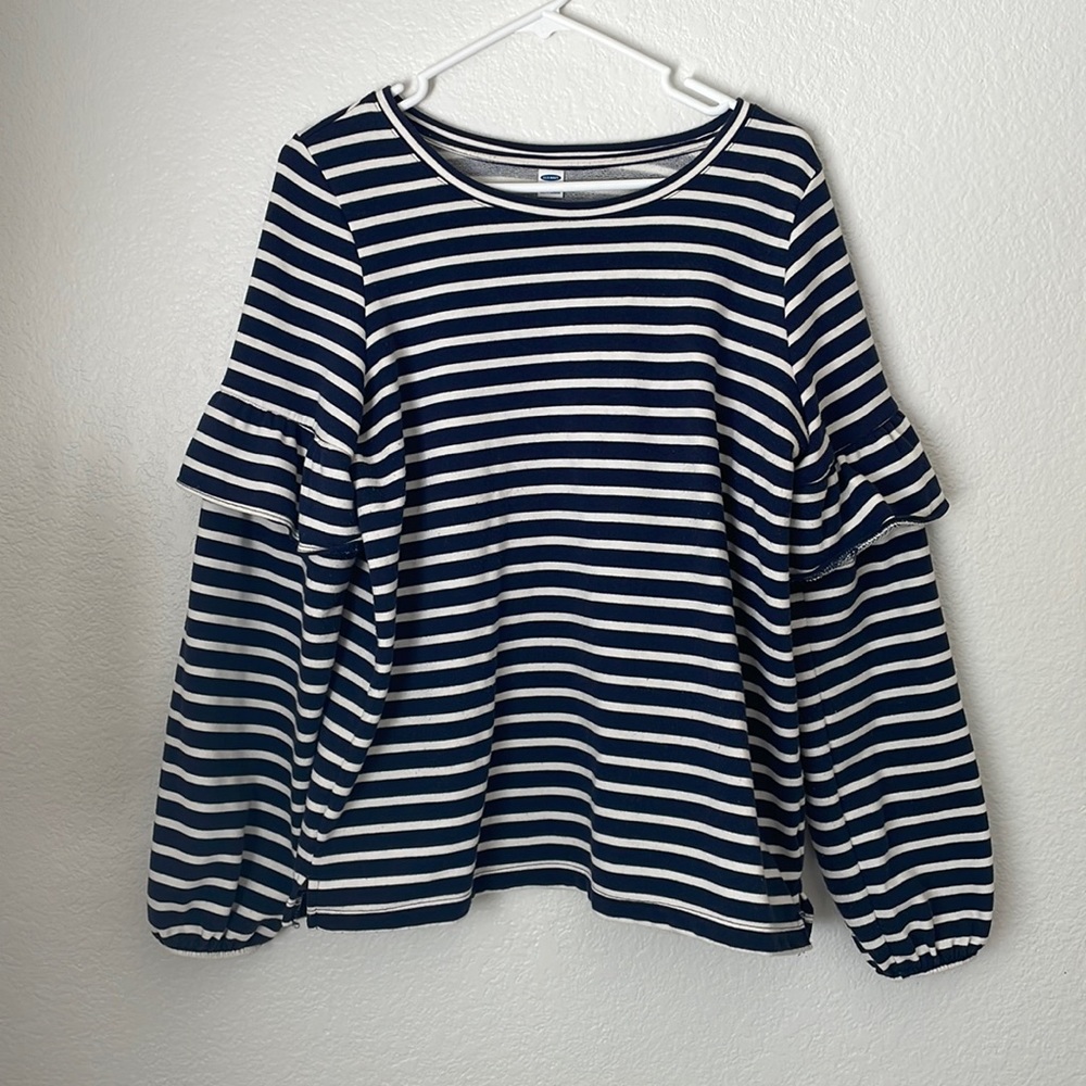 Navy and white striped sweatshirt with ruffle detail at the shoulder